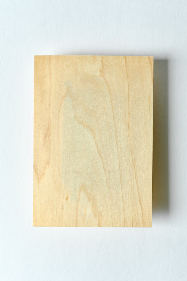 A Wooden Board Hanging On The Wall