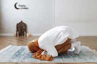 A Woman wearing Headscarf doing Praying