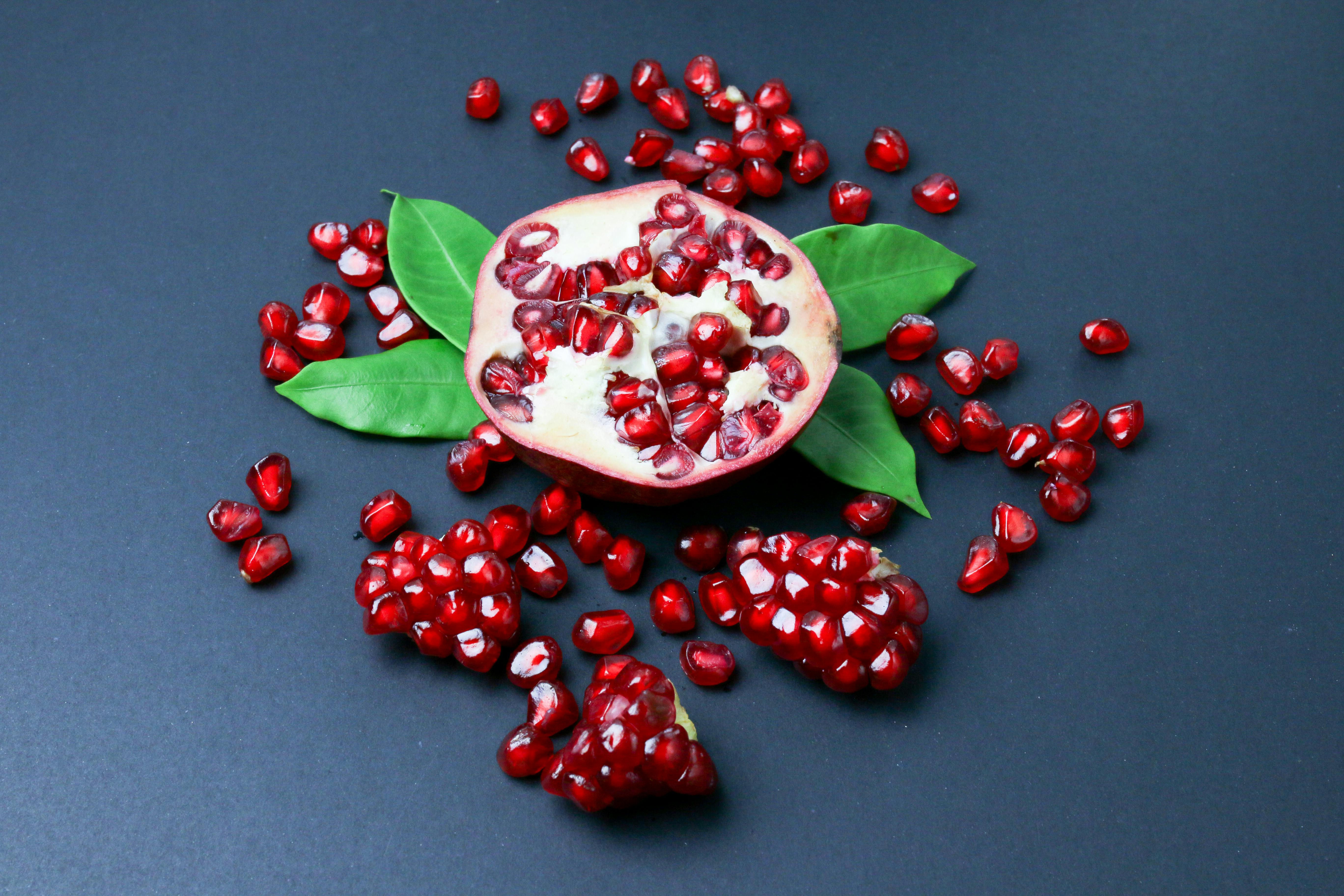 Pomegranates on a Wooden Stool · Free Stock Photo