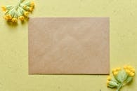 Brown Specialty Paper on Surface with Yellow Flowers