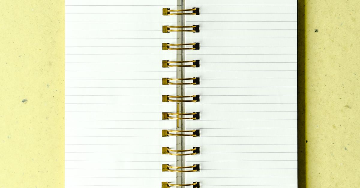 Computer Notepad Imges Photo of a Notepad on a Green Surface · Free Stock Photo