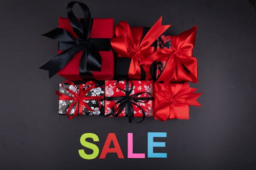 Free Gifts with Black and Red Ribbons Stock Photo
