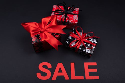 Free Red and Black Gifts on a Black Surface Stock Photo