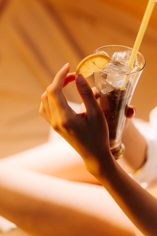Free Close-Up Shot of Person Holding a Cold Drink Stock Photo