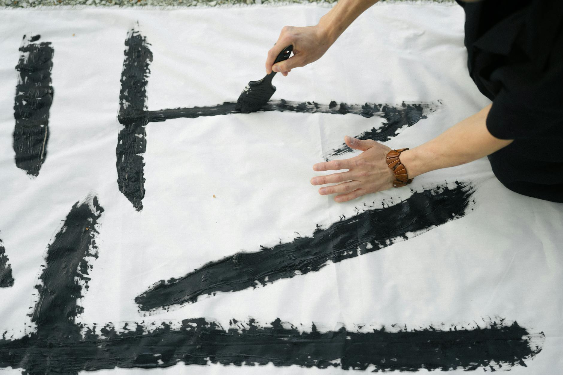 Person Doing Japanese Calligraphy