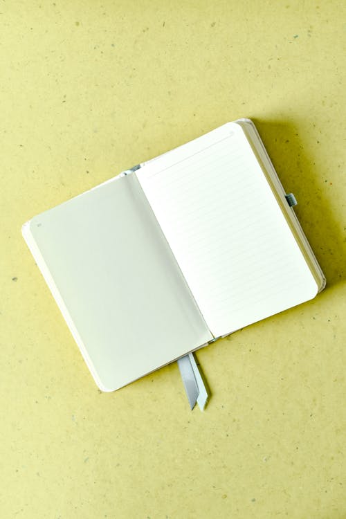 Foto profissional grátis de caderno, espaço do texto, página em branco