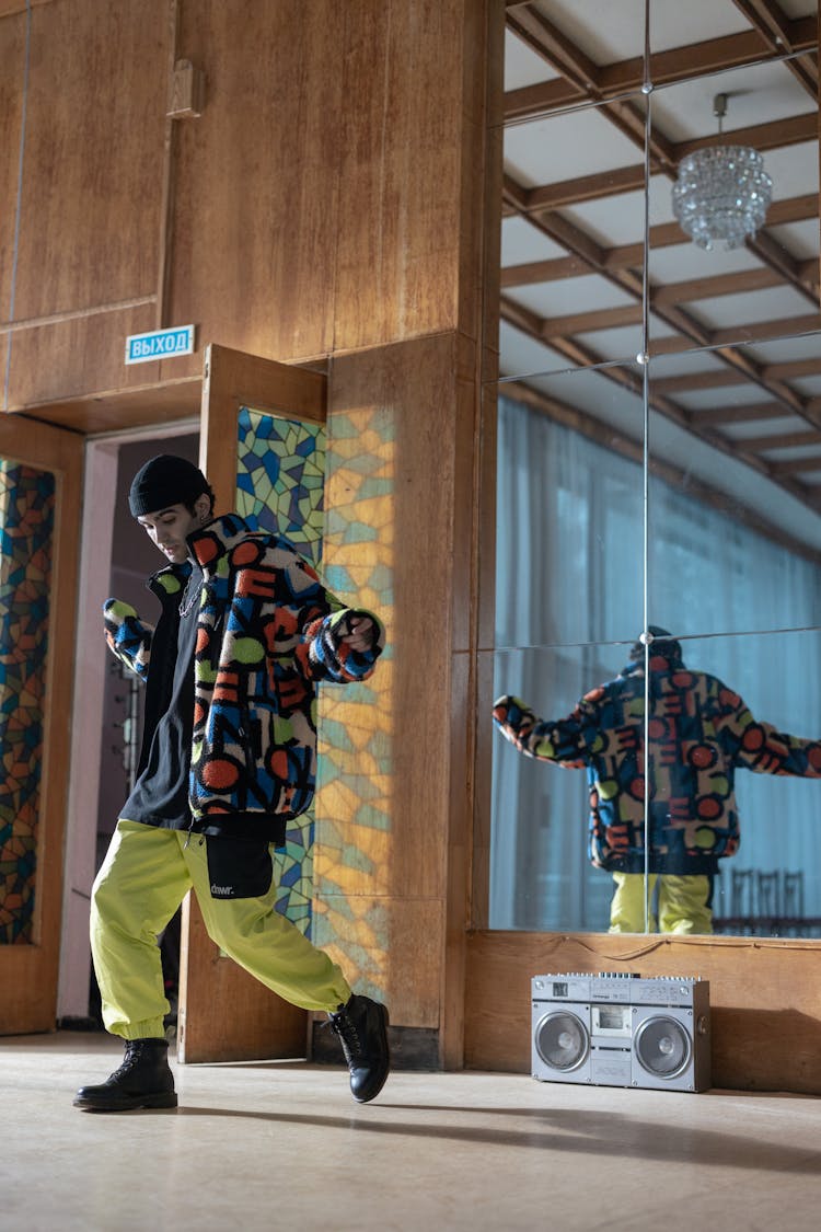 Photo Of A Stylish Man Dancing Near A Boombox