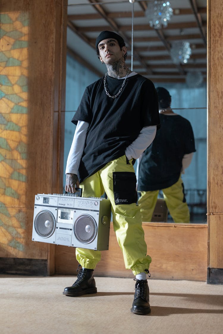 Photo Of A Man With A Boombox Posing With His Hand In His Pocket