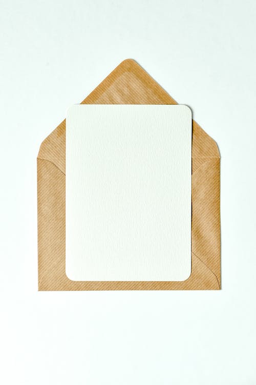 A Sheet of Paper on Top of a Brown Envelope