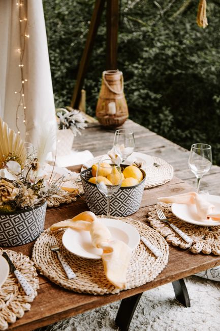 Elegant outdoor table setting with lemons and floral decor in Sigulda, Latvia.