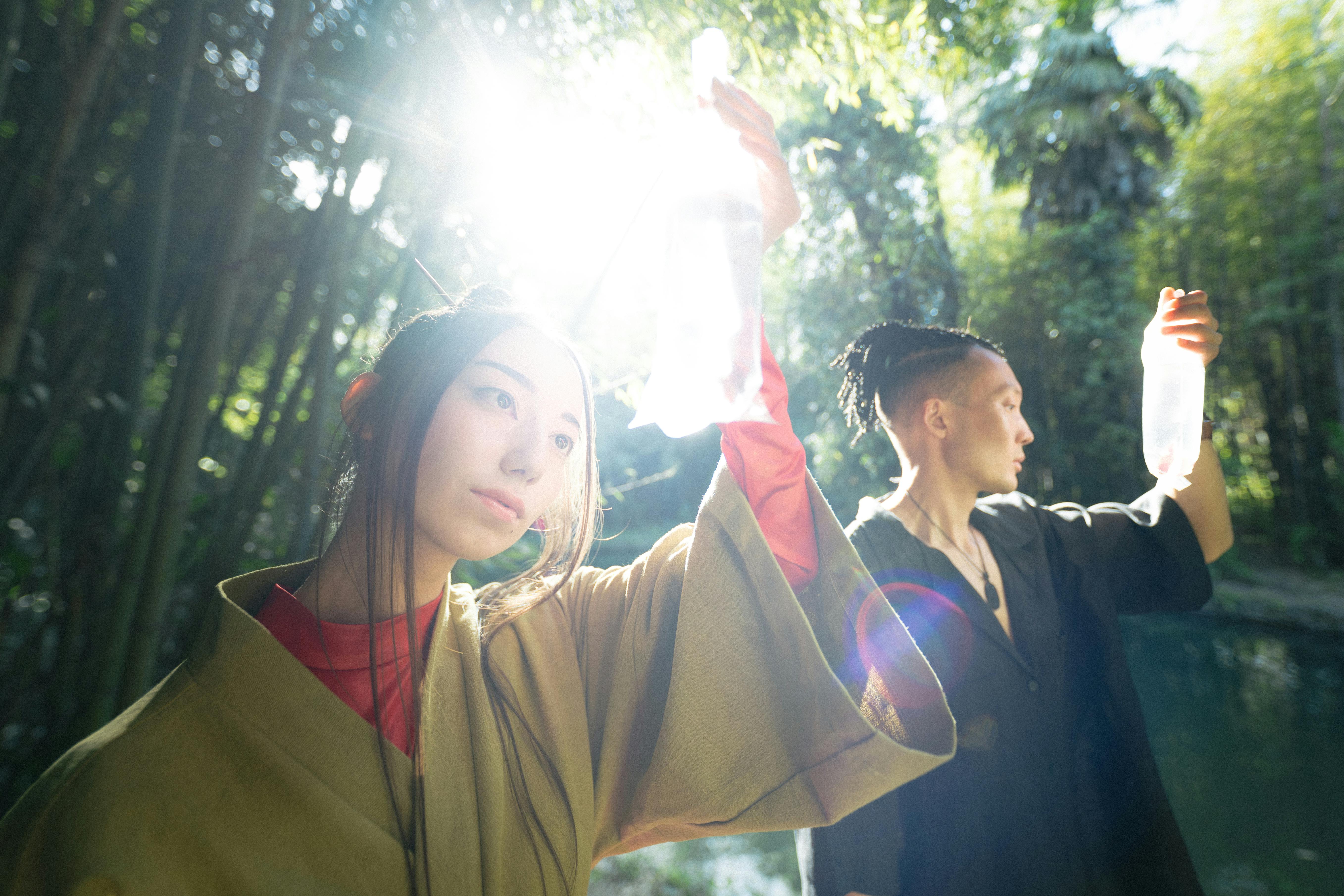 man and woman holding and looking at plastics with fish