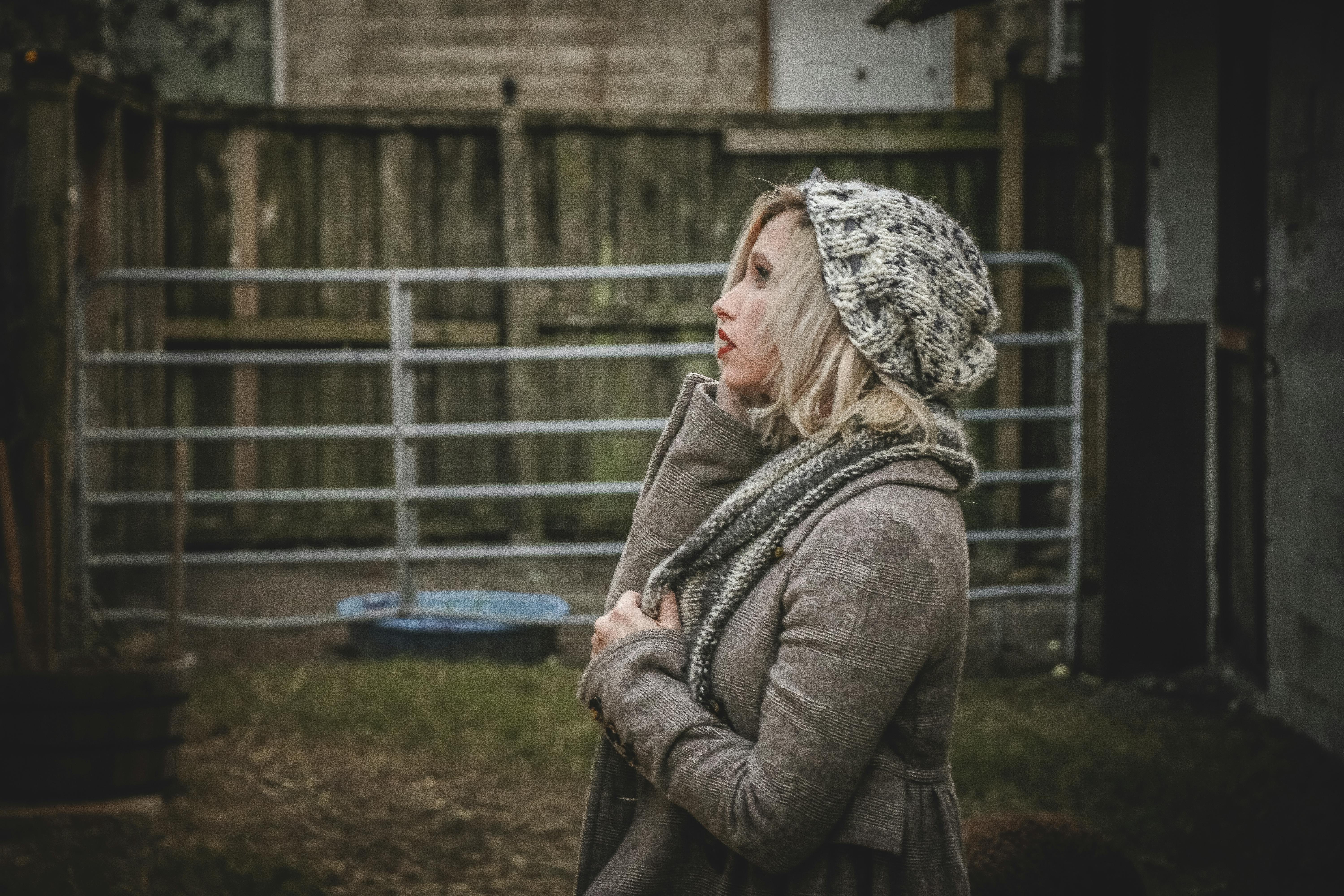 Woman Wearing Gray Hoodie and Knit Cap