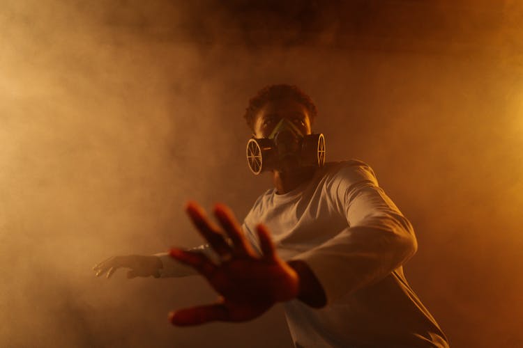 A Man In White Glasses Wearing A Gas Mask