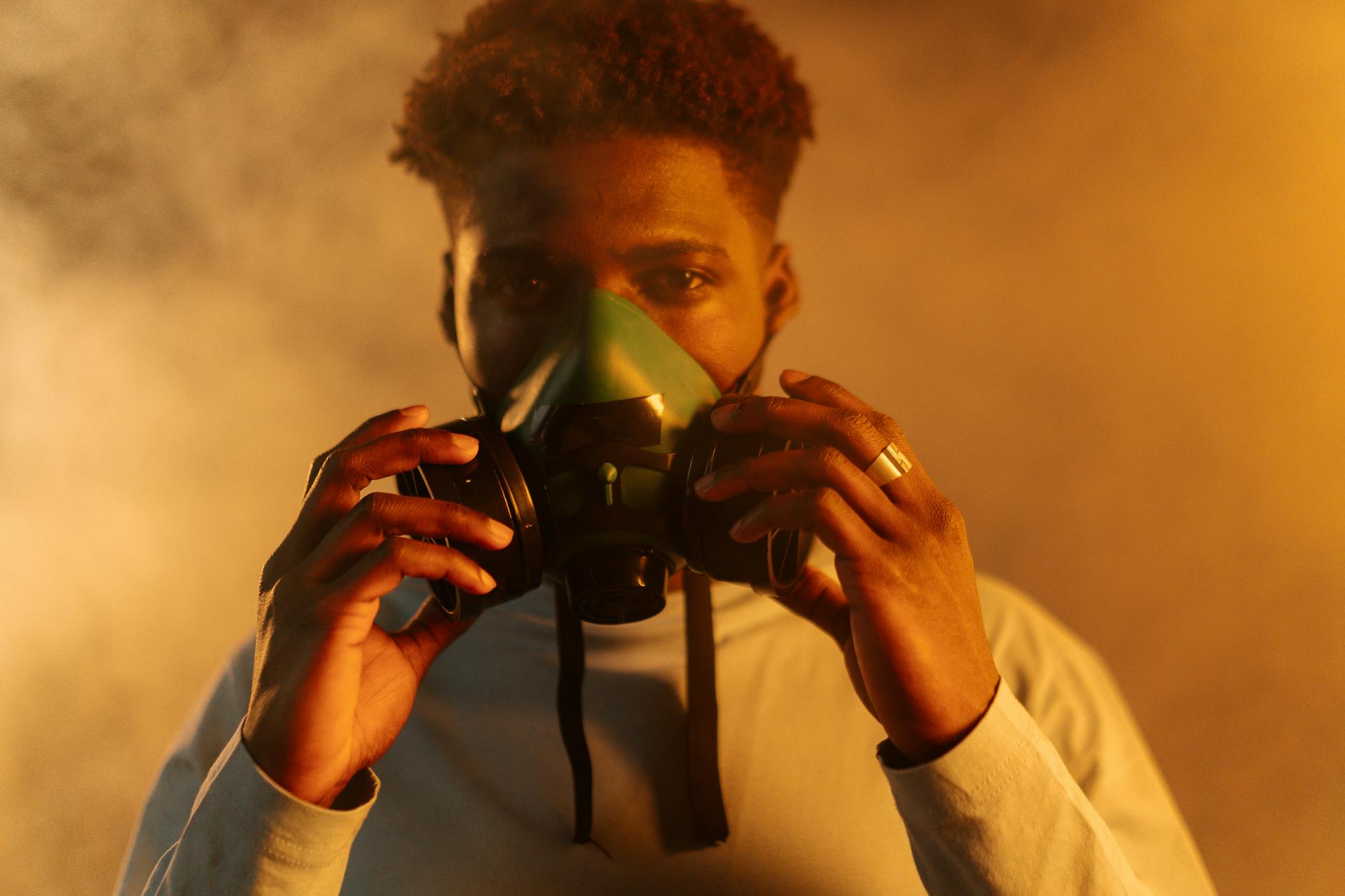 Close Up Photo of a Man Wearing Respirator