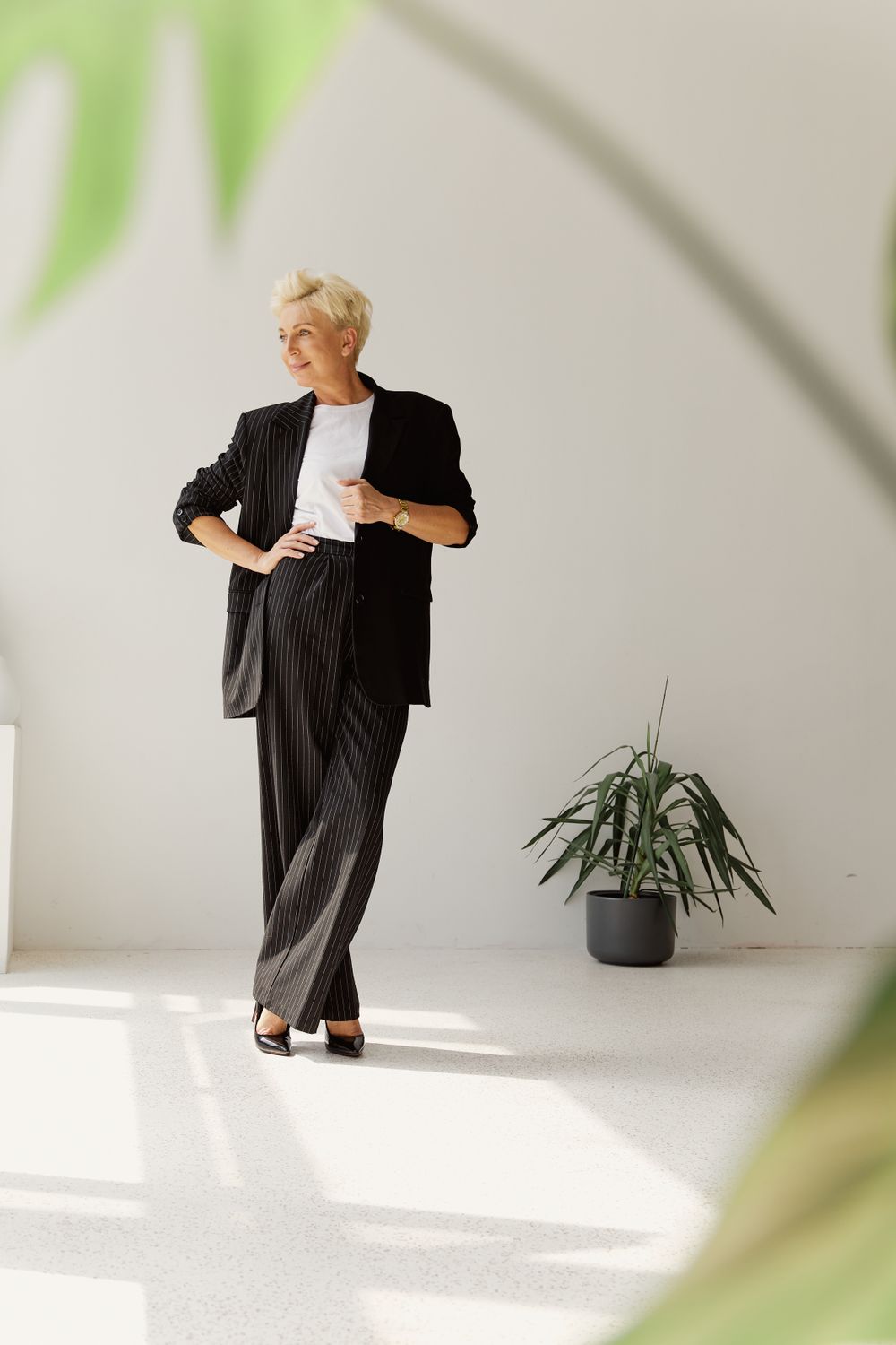 Woman in a pinstripe blazer with a pencil skirt