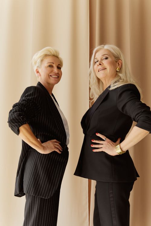 Free Two confident businesswomen pose proudly in elegant suits, showcasing leadership and style. Stock Photo
