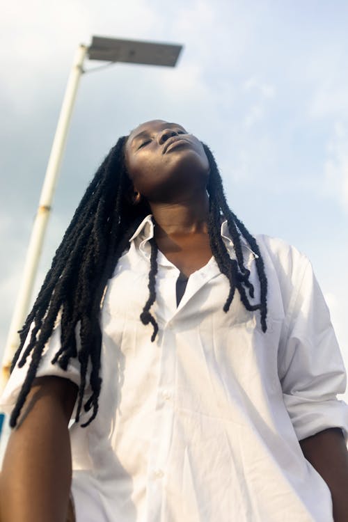 Low Angle Picture of Woman with Dreadlocks 