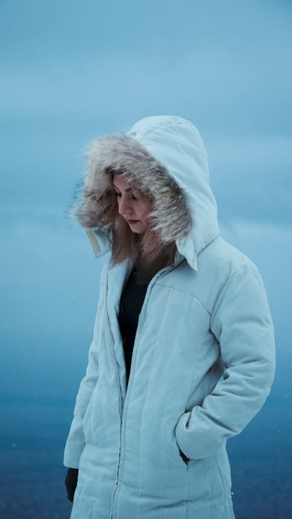 A Woman in White Winter Coat Standing