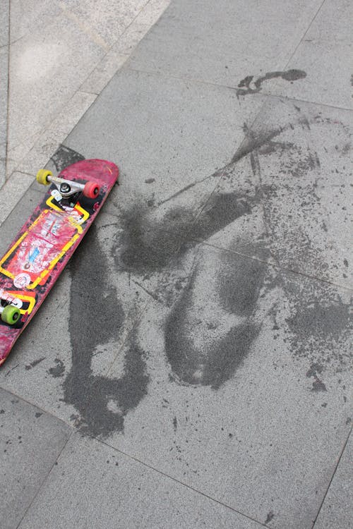 A Skateboard on a Concrete Floor