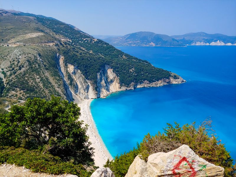 Stunning aerial view of Myrtos Beach with turquoise waters and rugged cliffs on Kefalonia Island, Greece