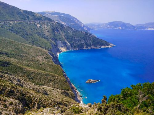 Free Breathtaking aerial view of cliffs meeting vivid blue sea. Perfect for nature and travel themes. Stock Photo