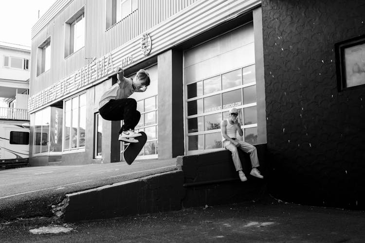 Guys Skating On Board On Street