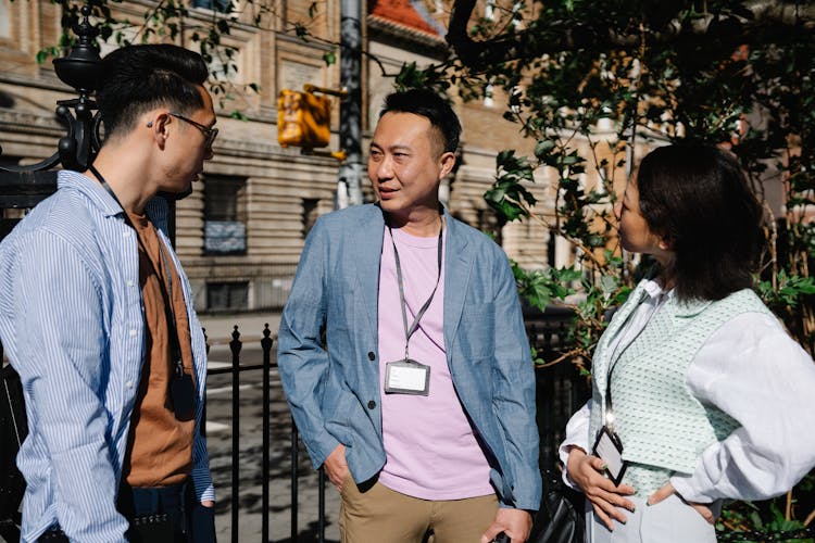 Colleagues Talking Outdoors On Office Break