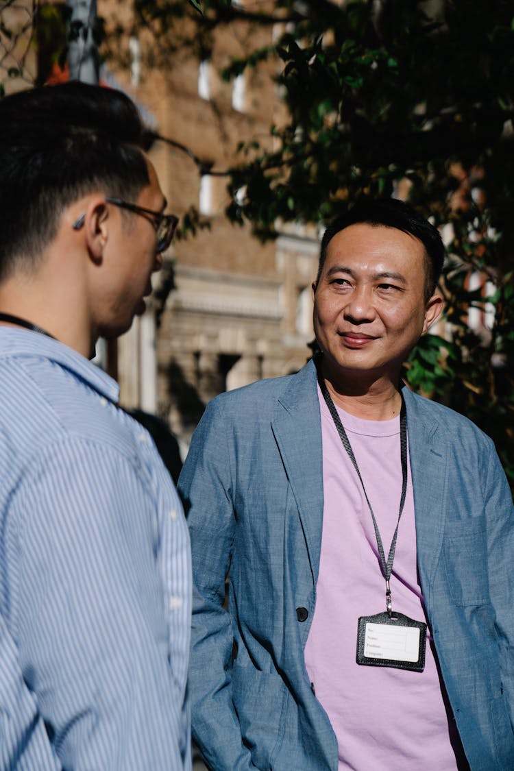 Men Talking Outdoors On Office Break