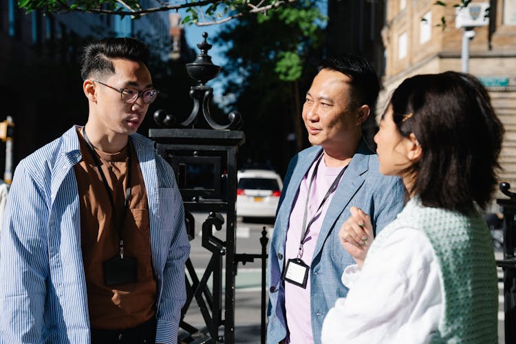 Colleagues Talking Outdoors On Office Break