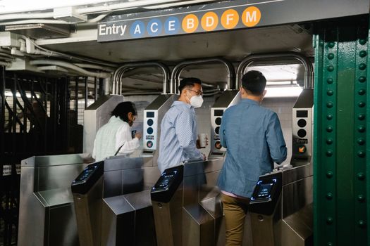 Man in White Dress Shirt Standing in Train