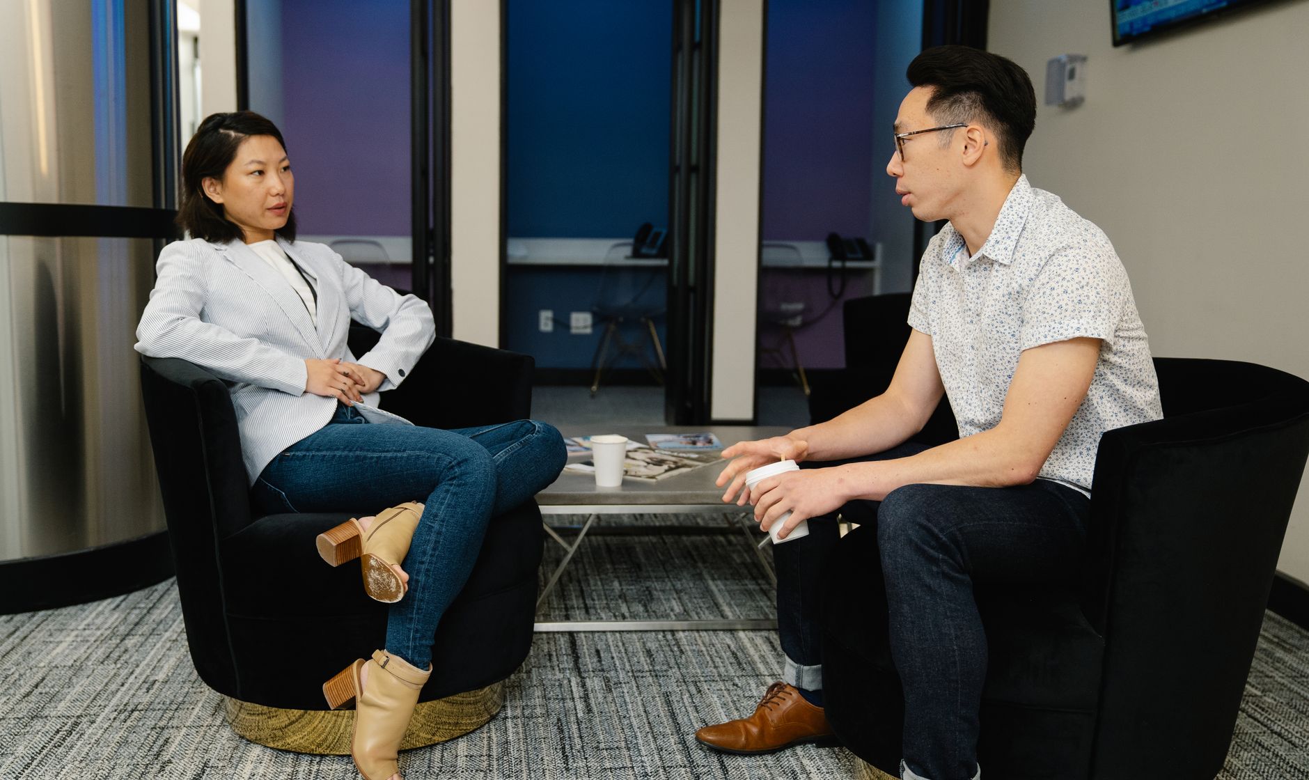 A diverse team of HR professionals from various backgrounds collaborating in a modern office setting in Seoul, demonstrating global HR in action.