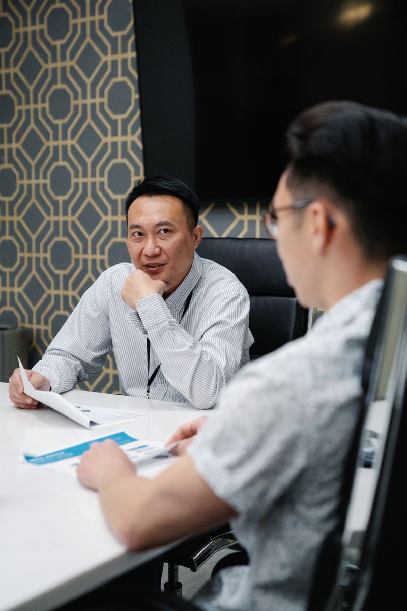 Support specialists working with headsets in an office