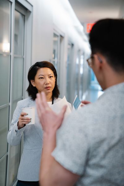 Colleagues in conversation — photo by Felicity Tai on Pexels