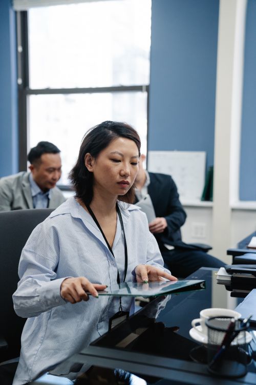 Free A diverse team in a business meeting, highlighting focus and professionalism. Stock Photo