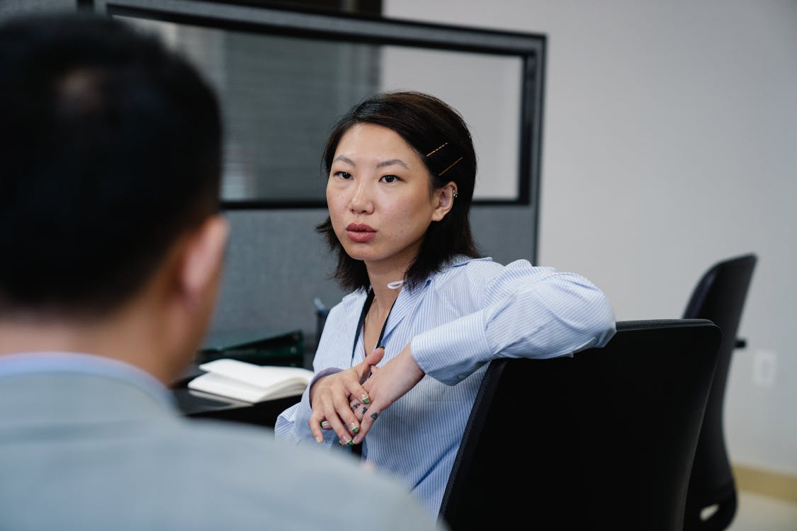 Real Estate Agent 
Woman in White Dress Shirt Smiling Stock Photo