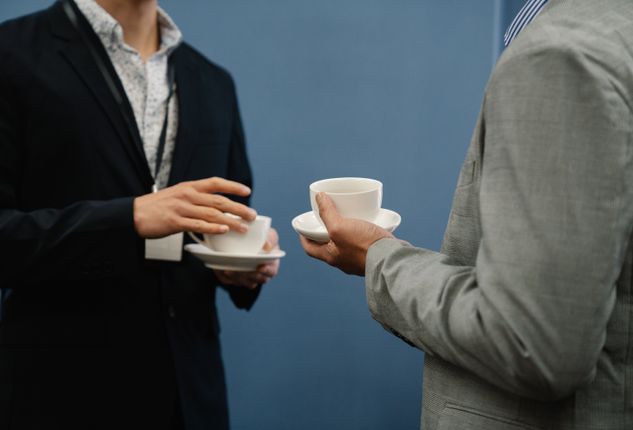couple having coffee on first date smiling