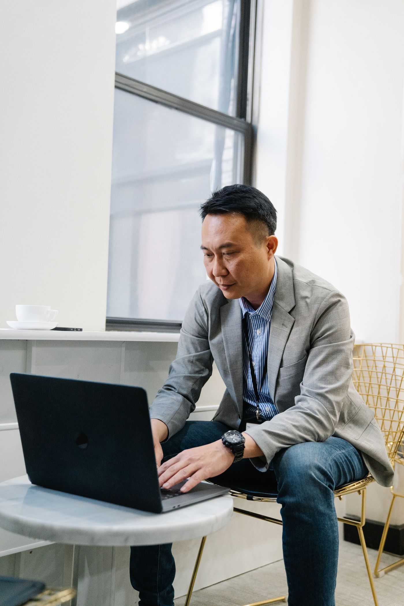Asian business professional using a laptop