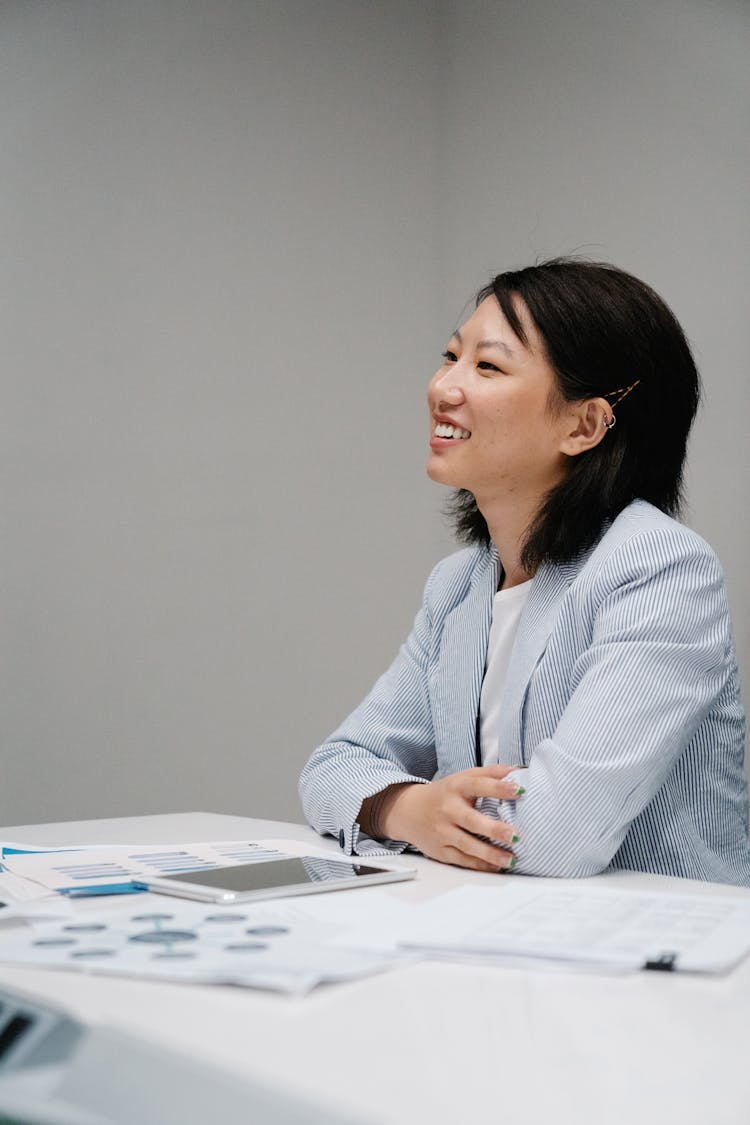 Portrait Of A Confident Woman Wearing Bright Jacket In An Office