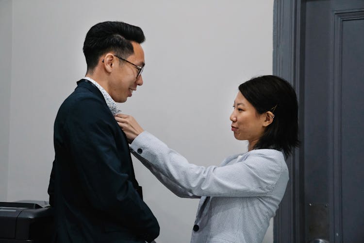 Woman Fixing Mans Tie