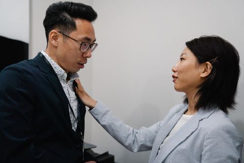 Free Two business professionals engage in a serious conversation indoors. Stock Photo