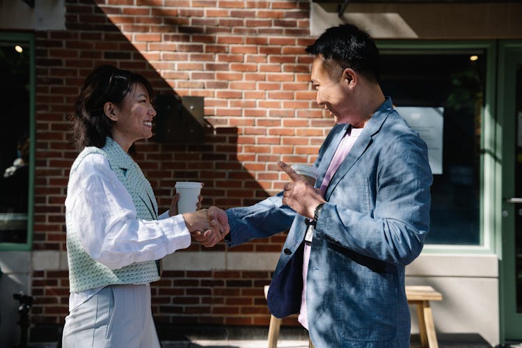 Smiling People Handshaking On Street