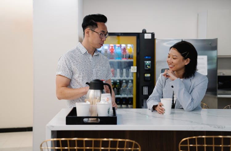 Woman And Man Having Coffee At The Bar 