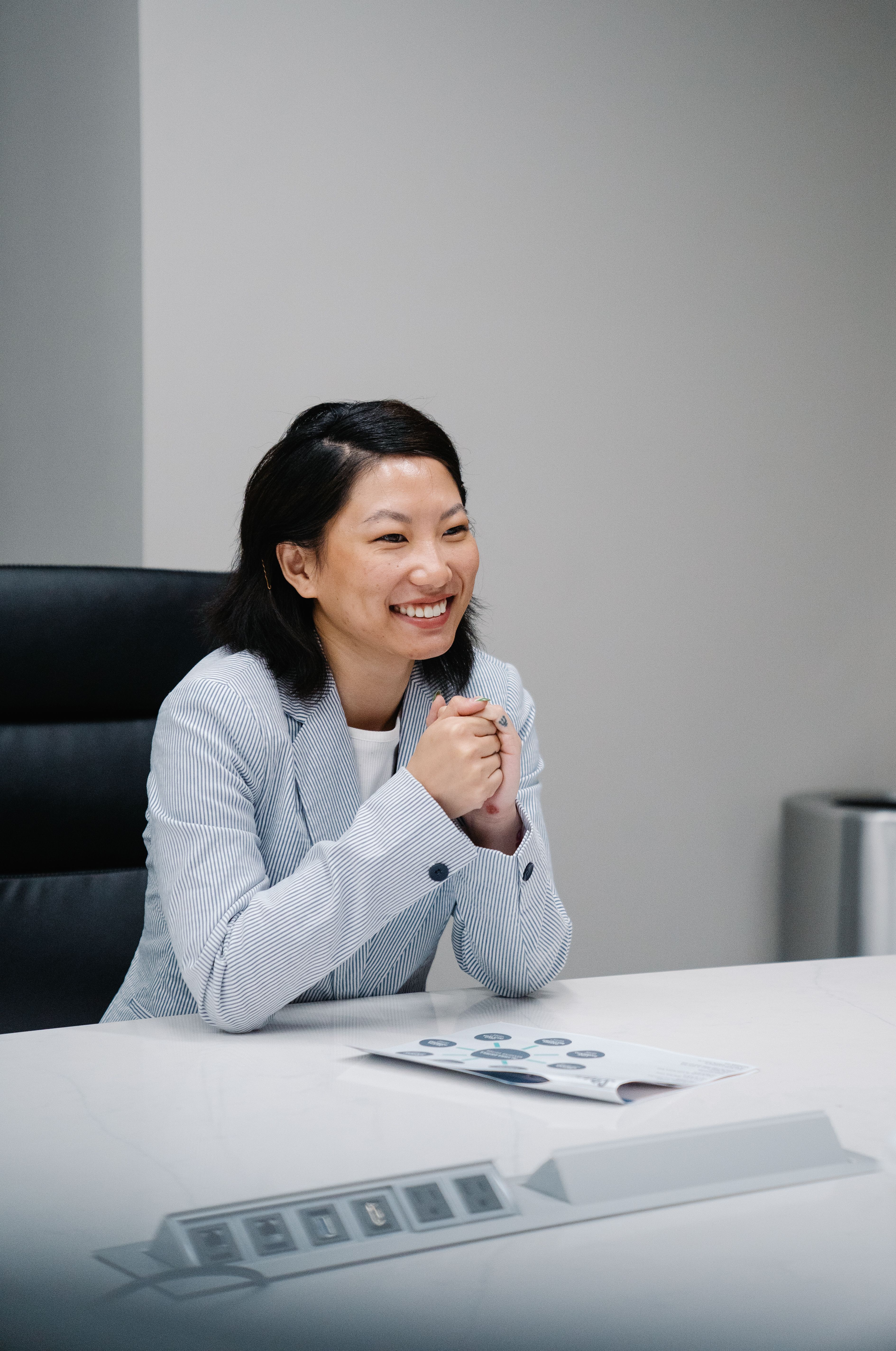 A Happy Woman Sitting at the Table · Free Stock Photo