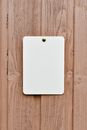 A White Paper Pinned on the Wooden Wall