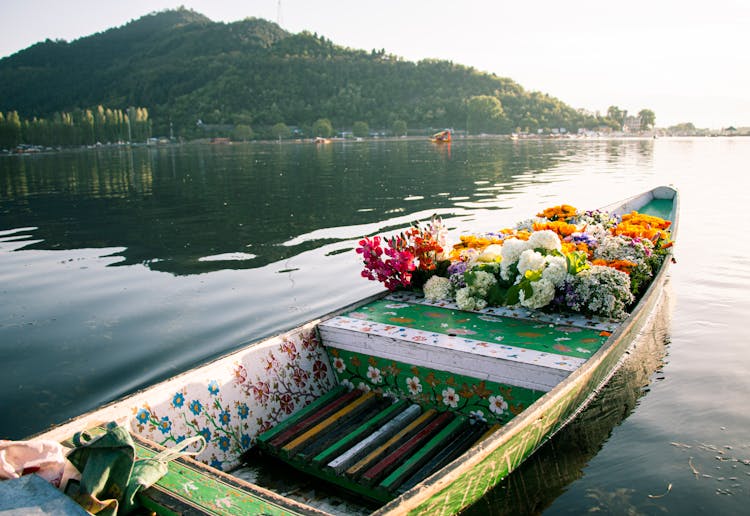 A Wooden Flower Boat On Dal Lake