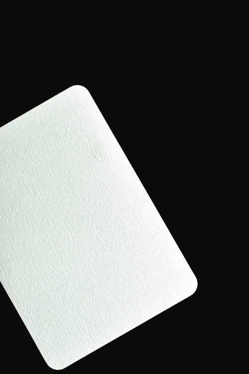 Free White Blank Paper on Black Background Stock Photo
