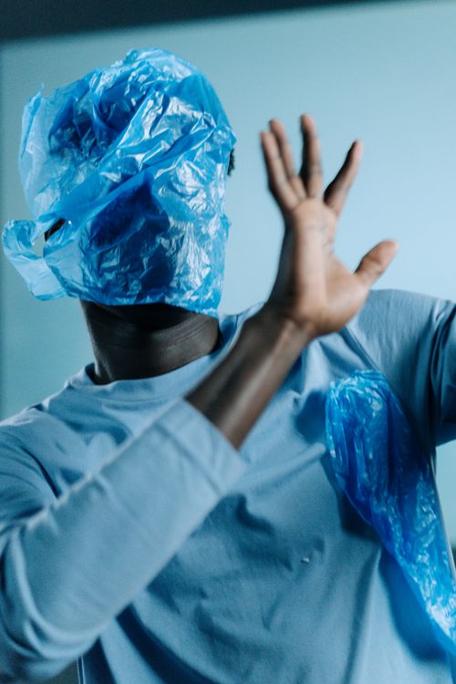 Free A creative depiction of plastic pollution highlighting its impact on humans with a symbolic use of plastic bags. Stock Photo