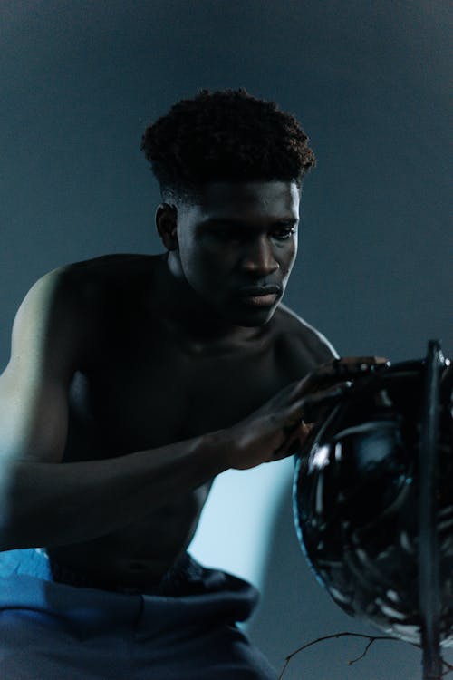 Young Shirtless Man Posing in Studio 