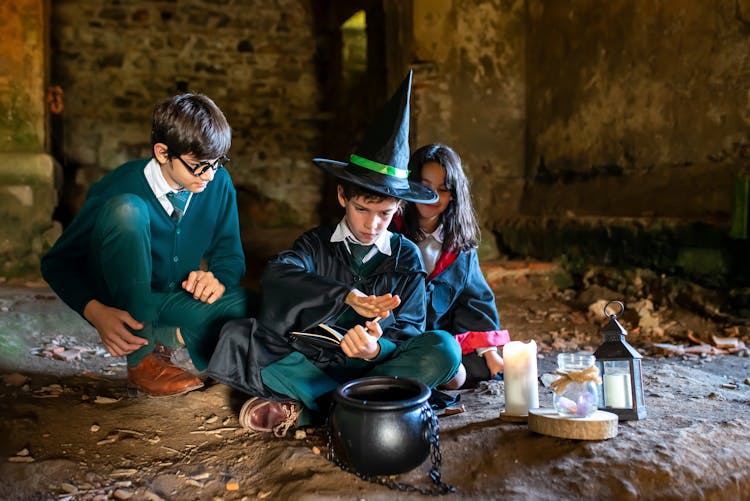 Wizards And A Witch Brewing A Potion