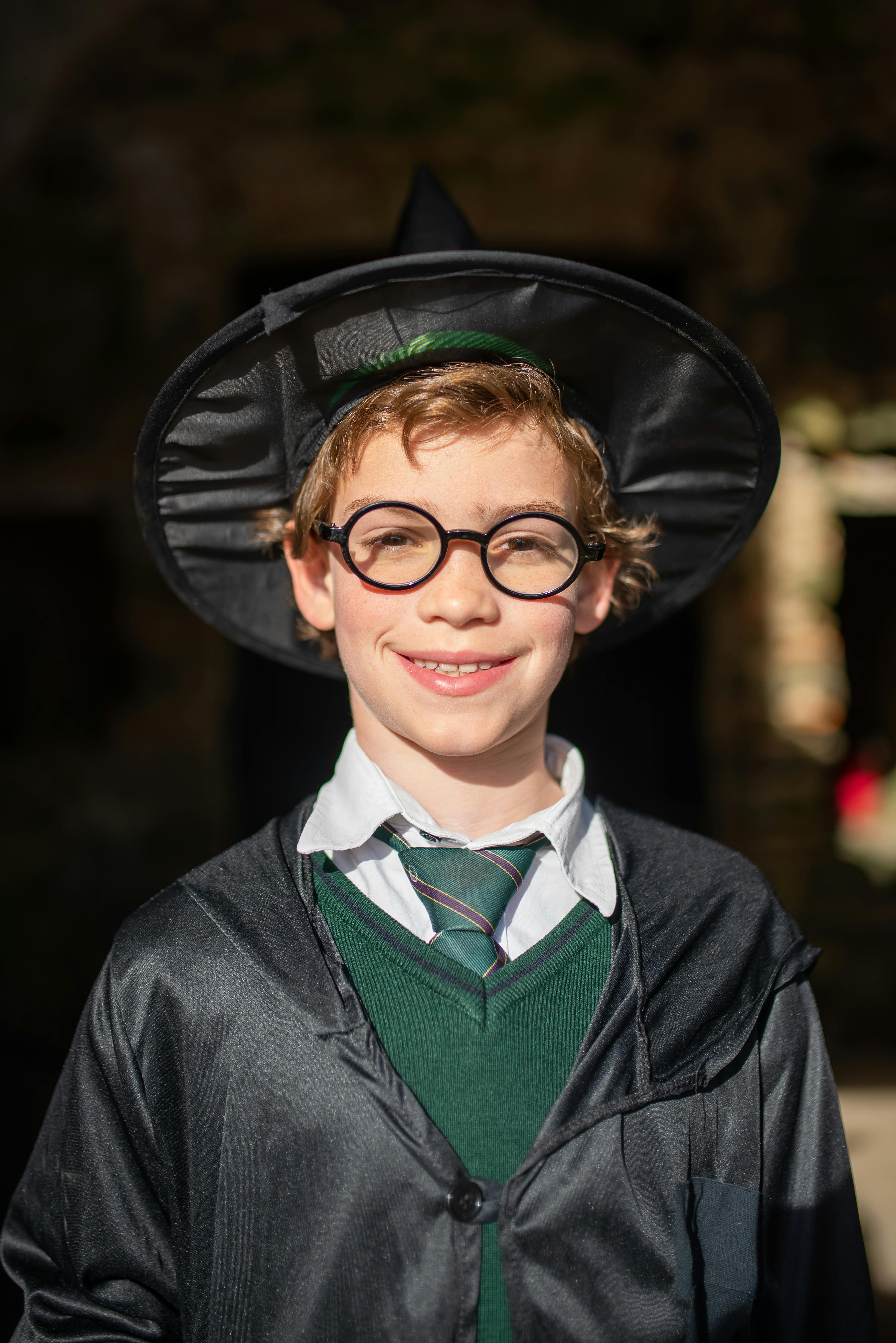 smiling boy in harry potter s costume